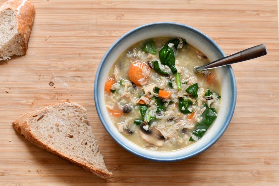 Chicken and wild rice soup with spinach and mushrooms.